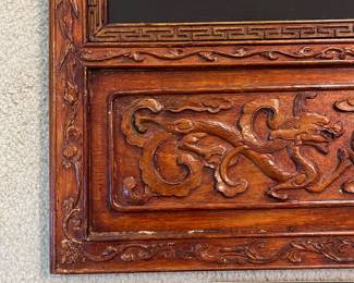 T93 - $750. PAIR of Chinese Ancestor Reverse Paintings on glass with intricately carved wood frame and brass hanging plates. Each Measures 21.75" x 41.5"T. Very good condition.