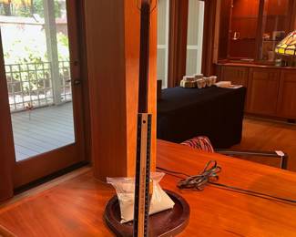 T35 - $30. Desktop Wood and Brass Pendulum and Pit. Measures 9" x 22" tall. Excellent condition.