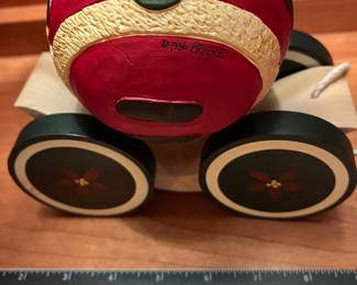 T123 - $120. Pair of Vintage Christmas 1988 BRIERE Mrs. Claus and 1986 Santa Folk Art Pull Toys. Each measures 7.25” x 6.5“ tall.