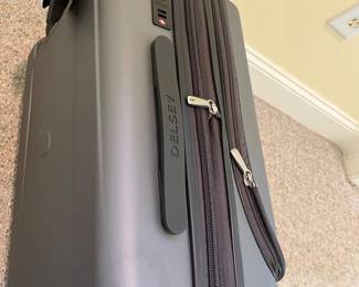 T88 - $55. Delsey Paris Carry On. Measures 22” tall.