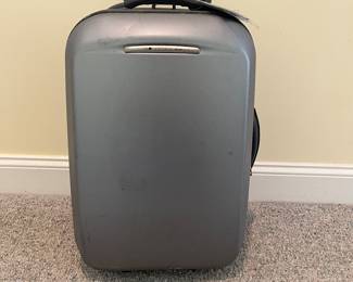 T88 - $25. Delsey Hard Case Carry On Suitcase. Has a lot of wear but clean inside. Measures 21” tall.