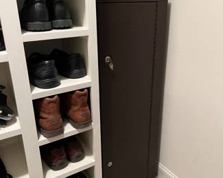 T114 - $150. Homak Keyed Metal Gun Safe. Measures 21" x 10" x 55" tall. Excellent condition.