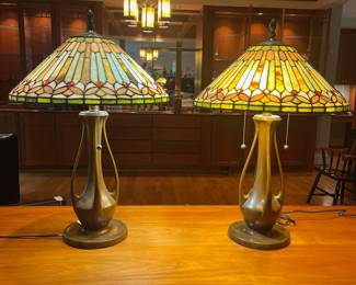 T119 - $450. Pair of Quoizel Lamps with Tiffany Style Lamp Shades. One lamp has a small chip but both are in great condition. Both lamp shades are in excellent condition with no chips or cracks noticed.