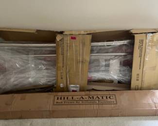 T53 - $100. Brushed nickel metal king size headboard, footboard, and adjustable bed frame. Hillsdale hill-a-matic brand.