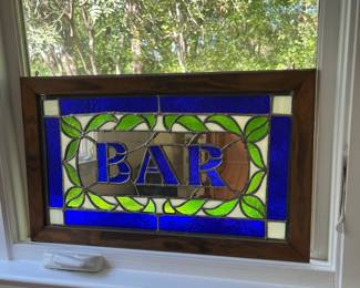 T102 - $80. Handcrafted stained glass bar sign with wood frame and hanging eyelets. Measures 24'" x 15.25" Tall. Very good condition.