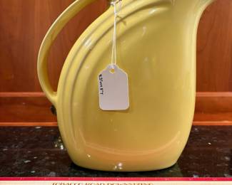 T4 - $20. Hall pottery pitcher in yellow. Measures 8.5" x 8" tall. Excellent condition.