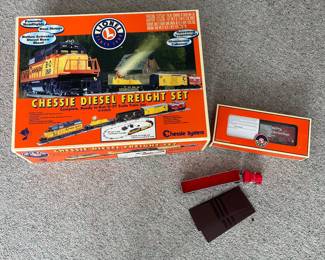 T58 - $165. Lionel 6-31915 Chessie Diesel Freight Set 0-27 Gauge Scale. Looks to be complete. Comes with EXTRA Lionel truck and 2002 Christmas box car 6-36243. Untested.