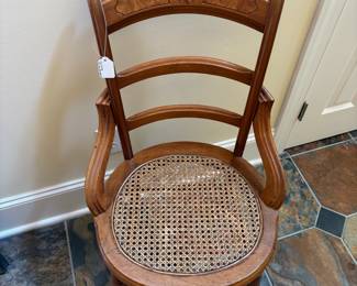 T24 - $40. Single Caned Chair. Measures 18" x 16.25" x 34.25" tall, Floor to seat 18". Very good condition.