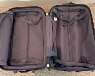 T88 - $25. Delsey Hard Case Carry On Suitcase. Has a lot of wear but clean inside. Measures 21” tall.