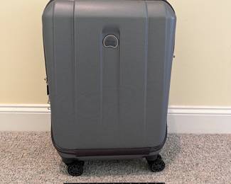 T88 - $55. Delsey Paris Carry On. Measures 22” tall.