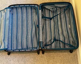 T87 - $80. Delsey Hard Case Suitcase. Measures 31“ tall.