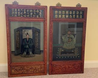 T93 - $750. PAIR of Chinese Ancestor Reverse Paintings on glass with intricately carved wood frame and brass hanging plates. Each Measures 21.75" x 41.5"T. Very good condition.