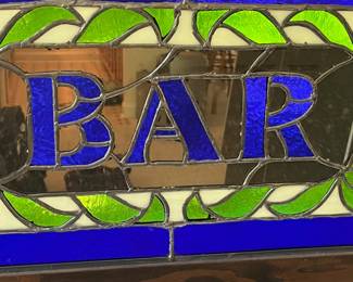 T102 - $80. Handcrafted stained glass bar sign with wood frame and hanging eyelets. Measures 24'" x 15.25" Tall. Very good condition.
