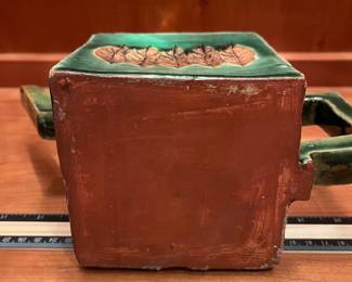 T29 - $25. Unsigned Pottery Teapot with Leaf Design. Measures 10" x 6.25" tall. Excellent condition.