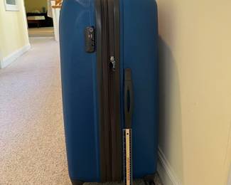 T87 - $80. Delsey Hard Case Suitcase. Measures 31“ tall.