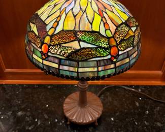 T5 - $125. Quoizel Table Lamp, Tiffany style shade with damage as shown in photo, Dragonfly motif. 18.5" tall.