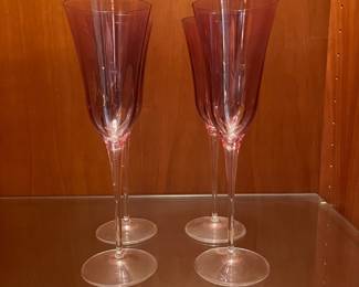 T121 - $40. Set of 4 Vietri Optical Amethyst Champagne Flutes. Each measures 10” tall.