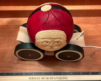 T123 - $120. Pair of Vintage Christmas 1988 BRIERE Mrs. Claus and 1986 Santa Folk Art Pull Toys. Each measures 7.25” x 6.5“ tall.