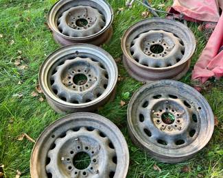Maybe 1936 Plymouth rims , two with trim rings