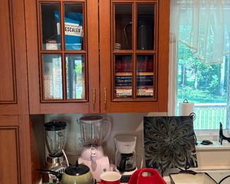 Blenders, coffee pot and other kitchen appliances.