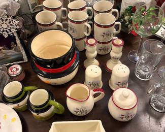 Full sets of Christmas coffee mugs, salt and pepper shakers, cream and sugar dispensers and bakeware
