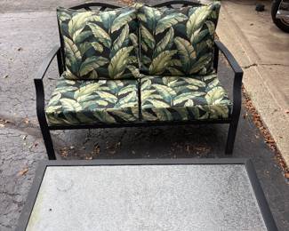 Outdoor patio loveseat with matching table