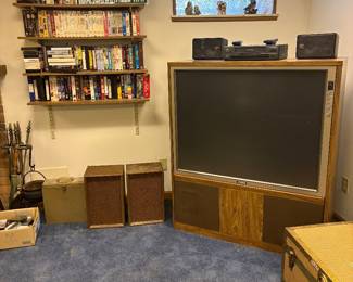 classic CRT rear-projection television console and speakers. Vintage VCR.