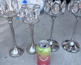 Set of 4 silver stemmed candle/votive holders. $15