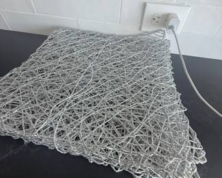 Set of silver wire placemats. $20
