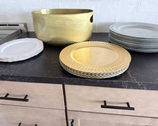 Entertaining collection — gold-tone charger plates, white decorative plates, hammered-gold beverage tub, placemats and more. $95 for all