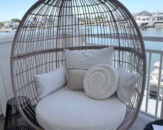 Oversized woven egg/hanging chair with full white cushion set. From the covered upstairs balcony. $325