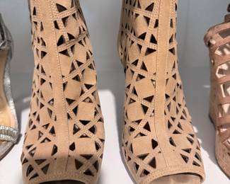 Part of the 20+ pair shoe collection (tan laser-cut booties shown). $200 for all