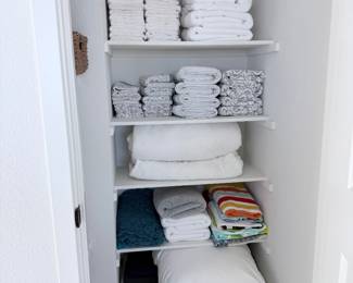 Folded towels + home linens — part of the neutral bedding bundle. $75 takes the bundle