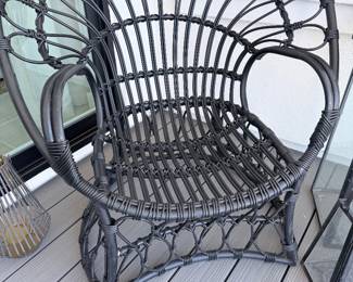 Black woven peacock accent chair — boho indoor or covered-patio chair. $75