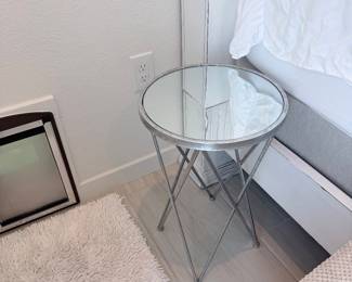 Round mirrored side table with X-base. $60