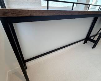 Industrial console table — dark wood top, black metal frame. $100