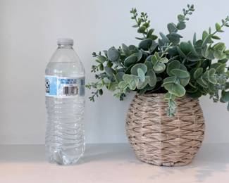 Woven seagrass vase with faux eucalyptus stems. $25