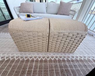 Woven seagrass storage bench — works as a coffee table or ottoman with hidden storage. $75