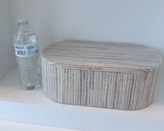 Oval woven storage box with lid. $20