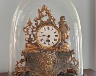 antique French gilt mantel clock under glass dome