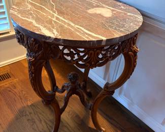 antique carved wood round tables w/ brown marble tops (2)