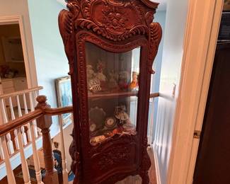antique heavily carved curio cabinet