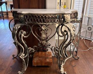 iron and stone scrollwork base console table