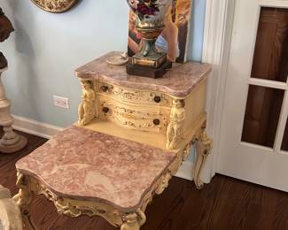 vintage pink marble carved end tables with cherubs