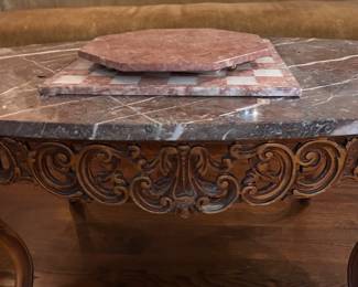 antique carved wood cocktail table with brown marble top