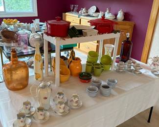 Glass depression, jugs, steel pans, ceramic bowls, matching cups, and saucers, and tea set.