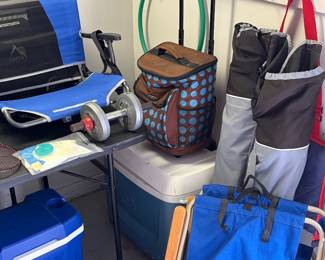 Pair of folding stadium chairs, pair of chairs in a bag and coolers.
