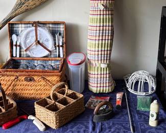 Vintage iron, hat, molds, wicker basket, and seat covering.