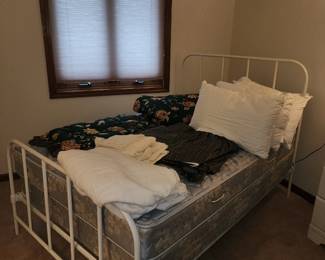 Antique double bed and bedding