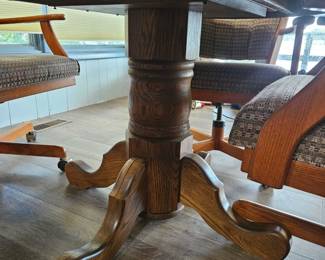 Oak Pedestal Dining Set with Swivel Chairs fourth image